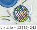 Asparagus with Meat on a Plate 135364242