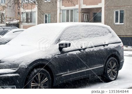 There is snow on the car. There is snow on the car. 135364844