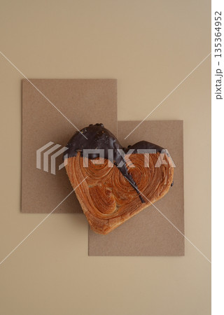 Empty paper note template sample mock up blank for wishes greeting holiday card Heartshaped pastry croissant treat topped with colorful frosting galore. Food experimentation viral dessert baking trend Empty paper note template sample mock up blank for wishes greeting holiday card Heartshaped pastry croissant treat topped with colorful frosting galore. Food experimentation viral dessert baking trend 135364952
