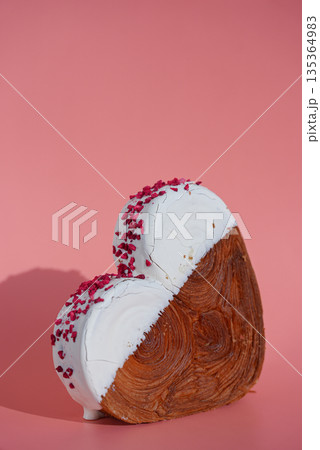 Delicious fresh croissant topped with colorful flavor Ganache. Creation unique heart shape bakery. Puff pastry holiday love gift present idea Valentine's day 135364983