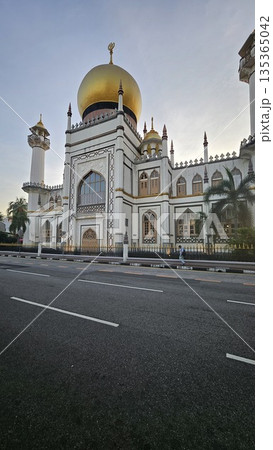 A majestic mosque with a golden dome  135365042