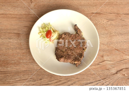 grilled pepper Ribeye beef steak and chop vegetable salad on plate  135367851