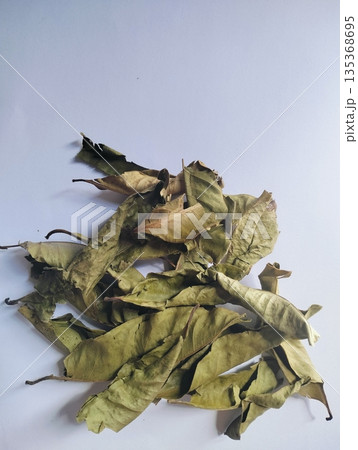 Aromatic dried bay leaves isolated on white background used as culinary herb and cooking spice 135368695
