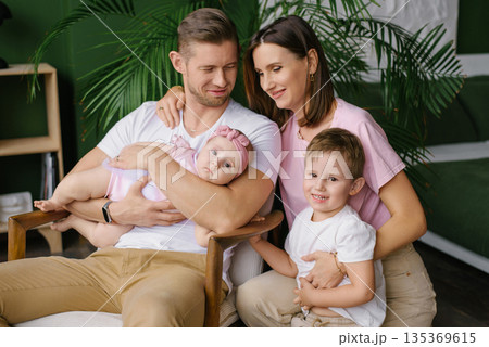 Loving Parents With Baby And Toddler Smiling 135369615