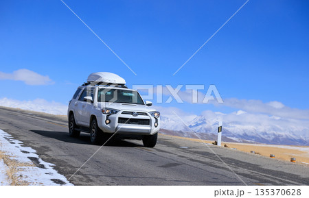 Toyota 4runner running on high altitude trail in Tibet ,China Toyota 4runner running on high altitude trail in Tibet ,China 135370628