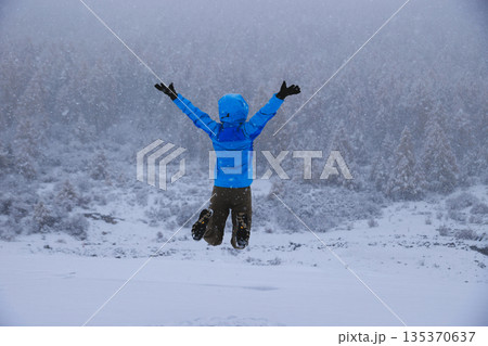 Asian woman enjoy the beautiful snowing landscape Asian woman enjoy the beautiful snowing landscape 135370637