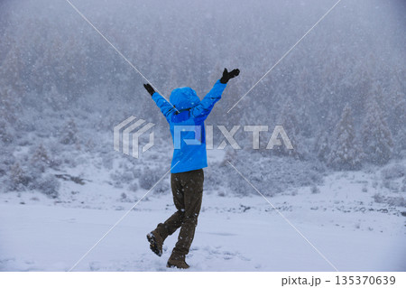 Asian woman enjoy the beautiful snowing landscape Asian woman enjoy the beautiful snowing landscape 135370639