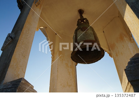 Old temple bell.An old, large, steel bell from the old temple tower. Old temple bell.An old, large, steel bell from the old temple tower. 135372487