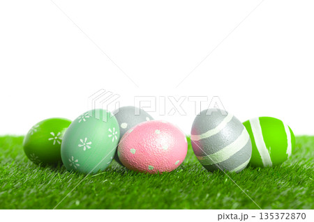 Colorful eggs placed on grass for spring celebration and decoration Colorful eggs placed on grass for spring celebration and decoration 135372870