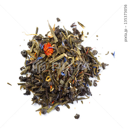 Loose leaf green tea with herbs and flower petals ready for brewing Loose leaf green tea with herbs and flower petals ready for brewing 135373056