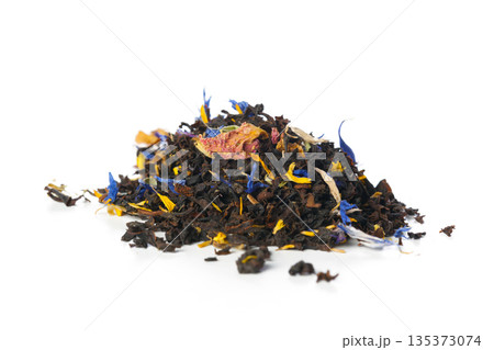 Loose leaf tea blend with dried flowers and herbs on a white surface for brewing purposes Loose leaf tea blend with dried flowers and herbs on a white surface for brewing purposes 135373074