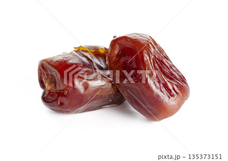 Fresh dates are placed next to each other on a white background for display Fresh dates are placed next to each other on a white background for display 135373151