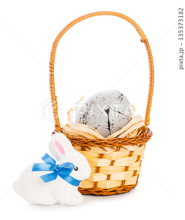 Bunny and basket with egg during spring holiday celebration 135373182