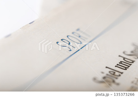 Document with the word sport written across the top in clear blue ink Document with the word sport written across the top in clear blue ink 135373266