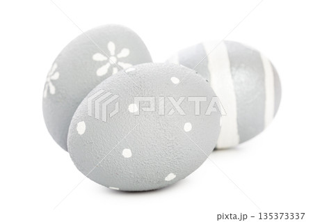 Decorative gray eggs arranged on a plain surface for holiday celebration 135373337