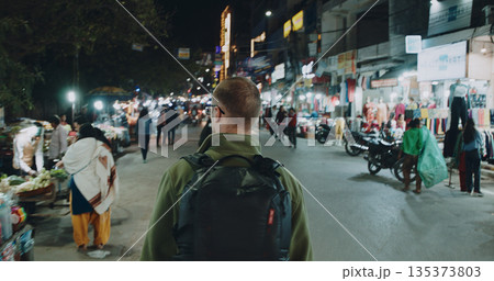 backpacker exploring night market street Delhi India evening backpacker exploring night market street Delhi India evening 135373803