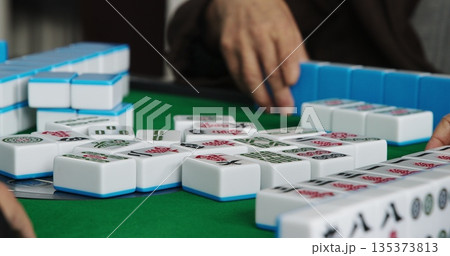 Chengdu, Sichuan, China. Men Playing Mahjong At Automatic Mahjong Table. Friendly Playing. Hands Of Mahjong Players. Asian Culture. Travel China. Chinese Tile-based Game. Live Game, Close Up View Chengdu, Sichuan, China. Men Playing Mahjong At Automatic Mahjong Table. Friendly Playing. Hands Of Mahjong Players. Asian Culture. Travel China. Chinese Tile-based Game. Live Game, Close Up View 135373813
