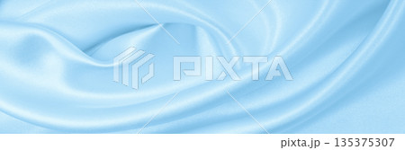 Smooth elegant blue silk or satin luxury cloth texture as abstract background. Luxurious background design 135375307