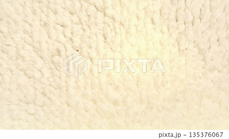 fluffy creamy wool texture closeup soft undulating fibers evoke cozy warmth in natural macro abstract ideal for serene wallpaper or design banner space 135376067