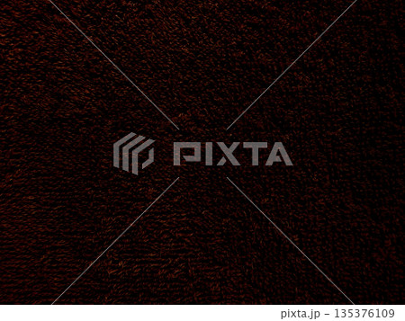 dark brown shaggy fur texture close-up capturing warm earthy tones and intricate curly fibers for abstract wallpaper or textured background design 135376109