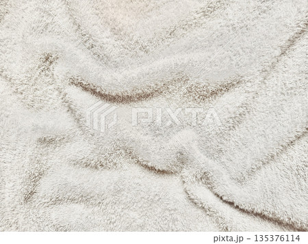 serene white fluffy towel texture undulating softly on pale blue canvas evoking calm spa ambiance perfect for wellness wallpaper or minimalist banner background serene white fluffy towel texture undulating softly on pale blue canvas evoking calm spa ambiance perfect for wellness wallpaper or minimalist banner background 135376114
