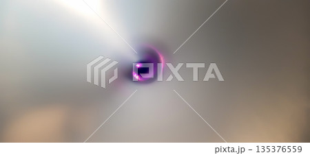 Abstract metallic swirl with purple glow. Abstract image featuring a metallic swirl with a smooth texture. Abstract metallic swirl with purple glow. Abstract image featuring a metallic swirl with a smooth texture. 135376559