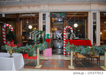 Festive shop entrance with christmas decorations. Shop entrance in a festive setting, located in "KVITKOVA", Odessa. 135377013