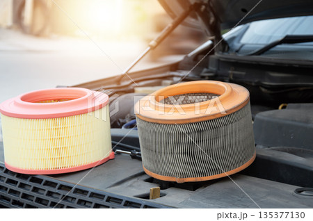 The engine air filter is sitting there, waiting to be replaced. The engine air filter is sitting there, waiting to be replaced. 135377130