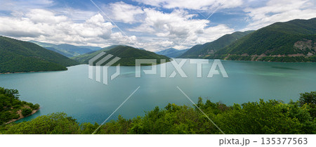 Zhinvali reservoir georgia with turquoise water and green mountains 135377563