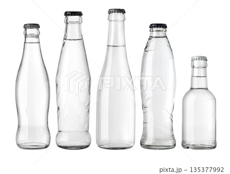 Various clear glass water bottles with caps against transparent background 135377992