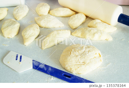dough, rolling pin, flour for making fresh homemade cakes 135378164