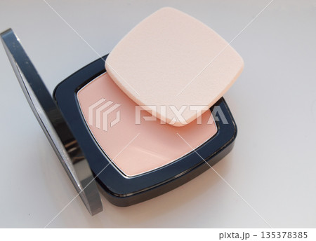 Compact powder with puff for makeup, on white background, top view Compact powder with puff for makeup, on white background, top view 135378385