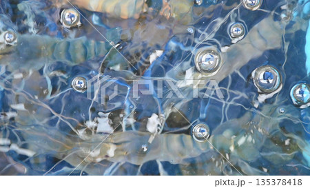 Abstract water surface bubble, blue liquid texture, white reflection line pattern, calm mood Abstract water surface bubble, blue liquid texture, white reflection line pattern, calm mood 135378418