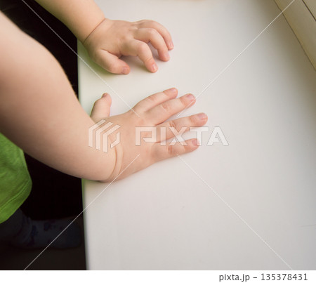 Child hand showing the five fingers isolated on a white background 135378431