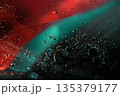 Floating Crimson And Teal Oil Universe In Liquid Motion 135379177