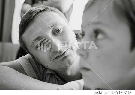 Father Admiring His Son in Black and White Portrait 135379717