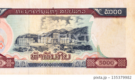 Government sanctioned Lao banknote 5000 Kip authorized for circulation cash banknote in Laos rear view Government sanctioned Lao banknote 5000 Kip authorized for circulation cash banknote in Laos rear view 135379982