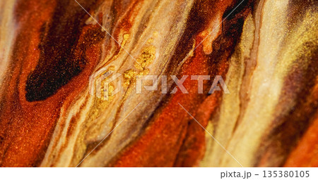 Glitter stream defocused. Shimmering mix. Yellow orange brown sparkling color particles blending on abstract ink leak texture background. 135380105