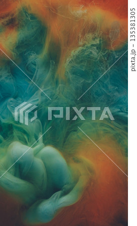 Blend ink. Fume water. Defocused orange blue yellow colorful smoke paint chemical wet mist growing on abstract dark black art background. 135381305