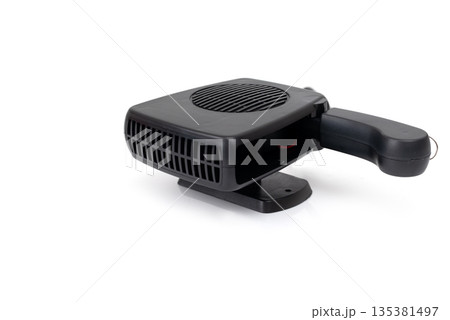 Compact black car heater powered by cigarette lighter, isolated on white background, portable automotive defrost device. 135381497