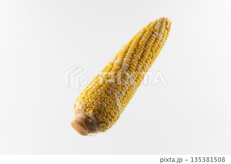 A cob of sweet boiled corn on a white background. 135381508