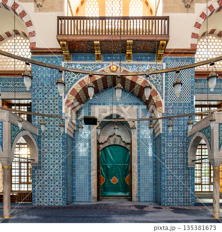 Rustem Pasha Mosque interior with intricate blue Iznik tiles, mihrab, and historic Ottoman architecture, Istanbul, Turkey. Rustem Pasha Mosque interior with intricate blue Iznik tiles, mihrab, and historic Ottoman architecture, Istanbul, Turkey. 135381673