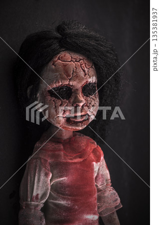 Creepy bloody doll face with long black hair in the dark 135381937