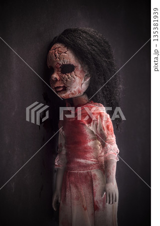 Creepy bloody doll face with long black hair in the dark 135381939