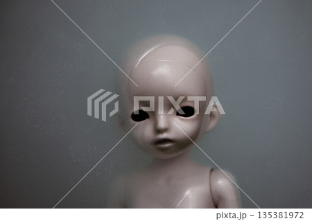 Creepy doll face in dark dirty water Creepy doll face in dark dirty water 135381972