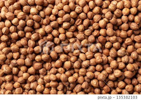 Shelled hazelnut, top view, background image Shelled hazelnut, top view, background image 135382103