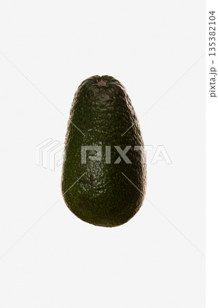 Ripe avocado on a white background Ripe avocado on a white background 135382104