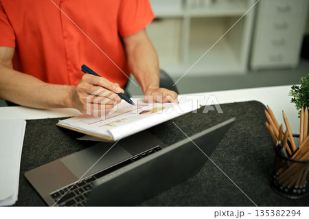 Document with a man checking searching document legal prepare paperwork or report for analysis Document with a man checking searching document legal prepare paperwork or report for analysis 135382294