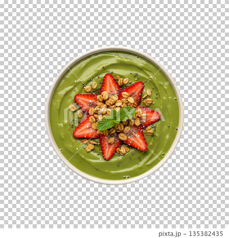 Vibrant green smoothie bowl topped with fresh strawberries, granola, and seeds, isolated. Perfect healthy breakfast or fitness meal 135382435