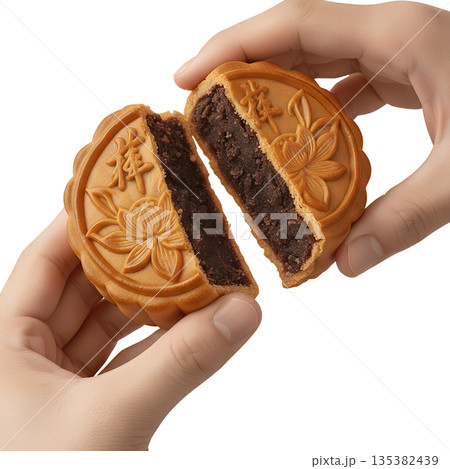 Hand holding and splitting open traditional mooncake to reveal the sweet paste filling, perfect for mid-autumn festival and asian culture Hand holding and splitting open traditional mooncake to reveal the sweet paste filling, perfect for mid-autumn festival and asian culture 135382439